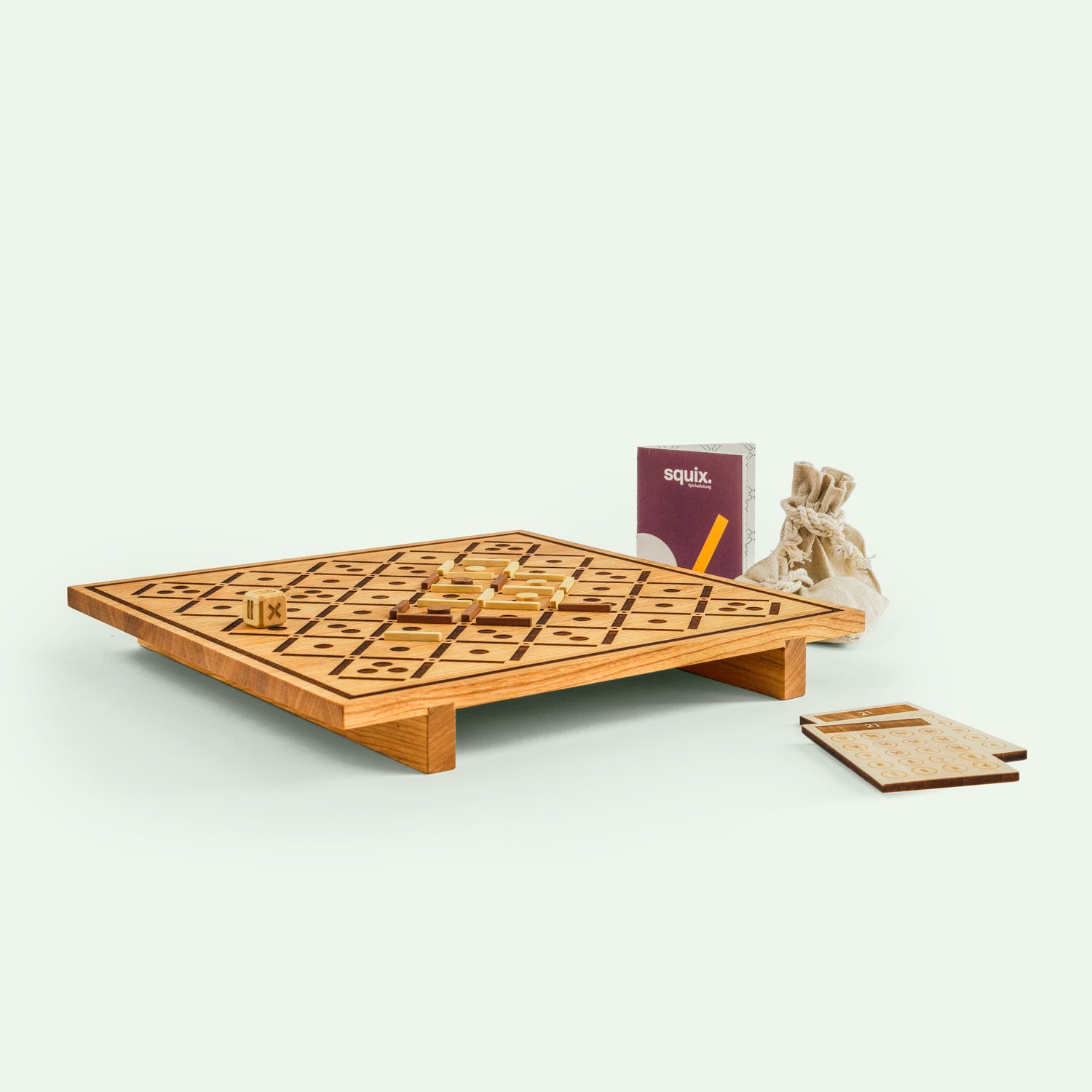 Squix Vollholzspiel in der kleineren Variante, mit Spielsteinen und Handbuch